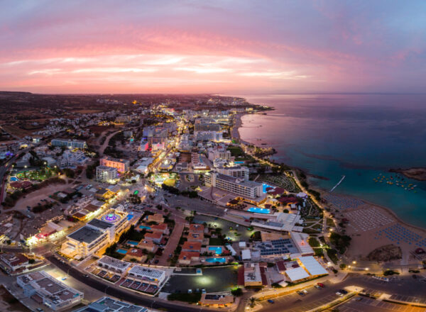 Aerial drone shot of Protaras city at sunset. Vibrant sun. Cyprus beauties