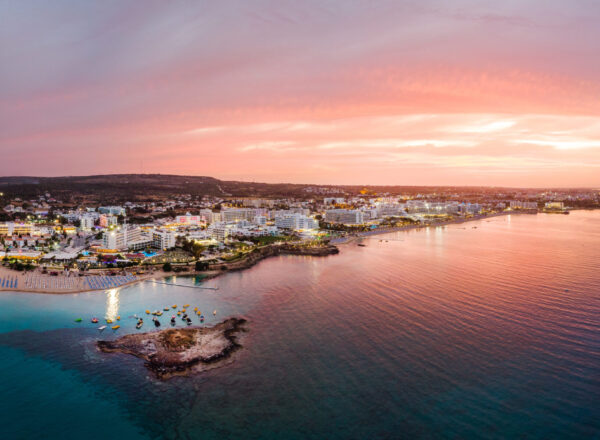 Aerial drone shot of Protaras city at sunset. Vibrant sun. Cyprus beauties